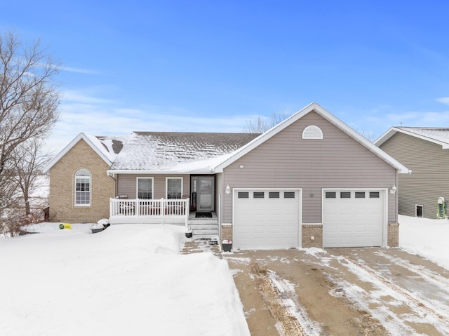 view of front of home with a garage and covered porch