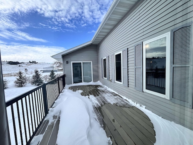 view of snow covered deck