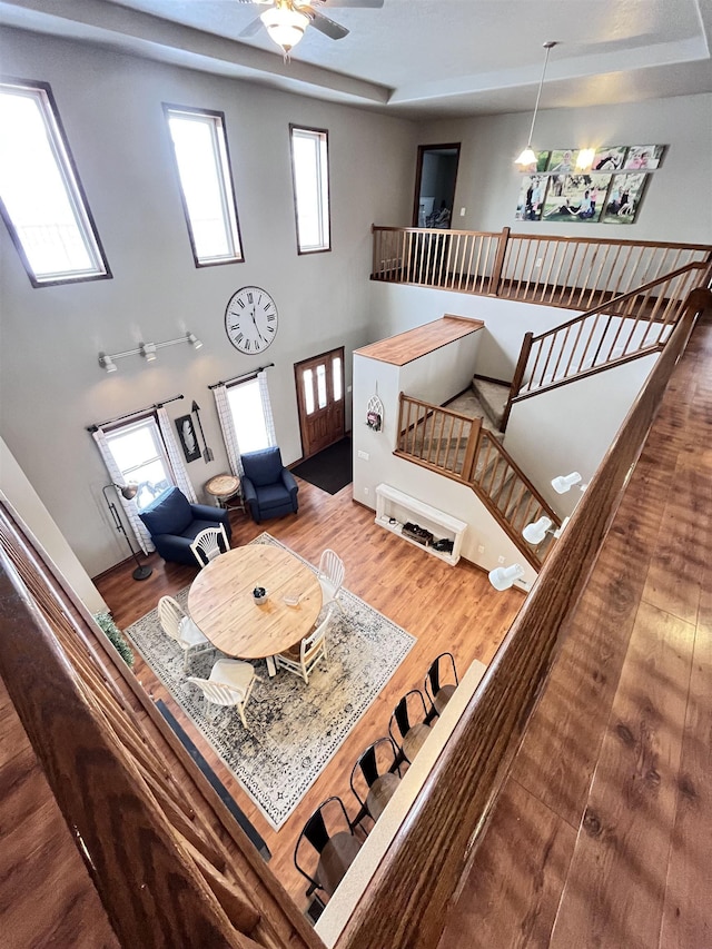 living room featuring ceiling fan and hardwood / wood-style floors