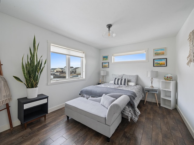 bedroom with dark wood-type flooring