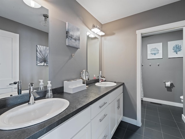 bathroom with tile patterned flooring and vanity