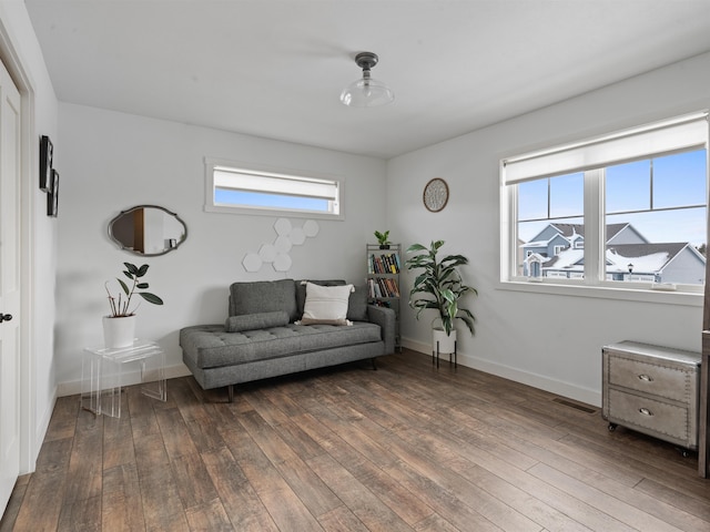 sitting room with dark hardwood / wood-style floors