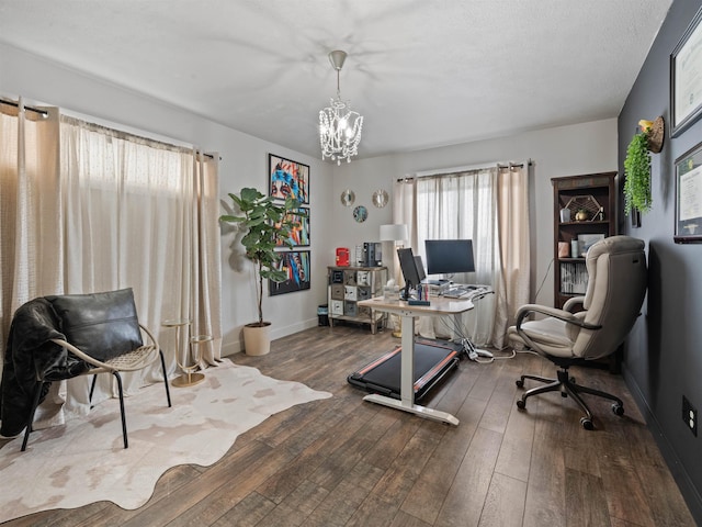 office featuring a chandelier and dark hardwood / wood-style floors