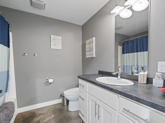 bathroom featuring toilet, vanity, and concrete flooring