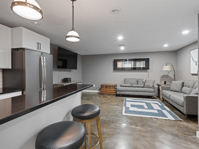 living room featuring concrete floors