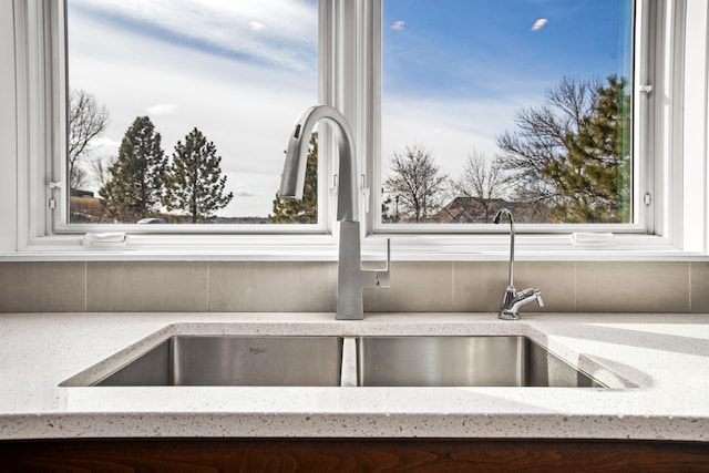 interior details with light stone counters and sink