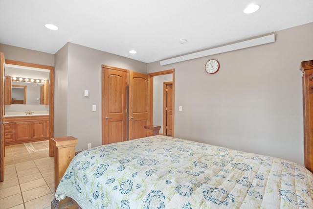 529 Rice Lake Rd, Rice Lake, ND 58735 - bedroom with ensuite bathroom, light tile patterned floors, and sink