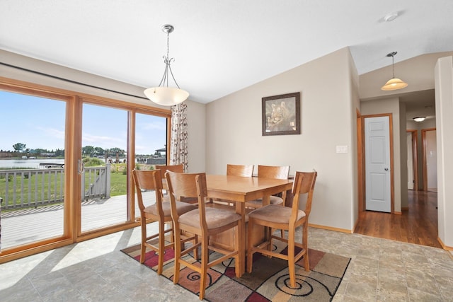 529 Rice Lake Rd, Rice Lake, ND 58735 - dining area with a water view and vaulted ceiling