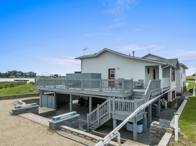 529 Rice Lake Rd, Rice Lake, ND 58735 - rear view of property with a patio area and a deck