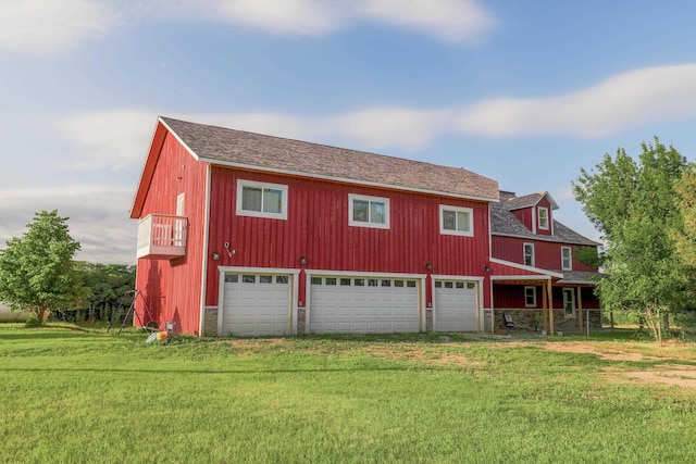 exterior space with a front yard and a garage