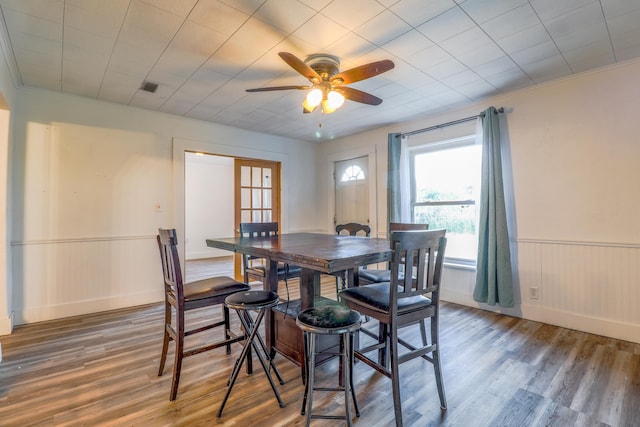 dining room with hardwood / wood-style flooring and ceiling fan