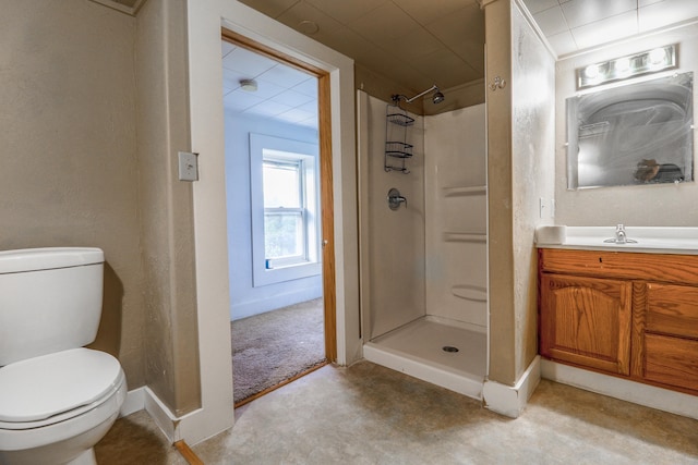 bathroom featuring a shower, toilet, and vanity