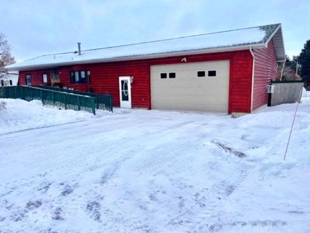 view of snow covered garage