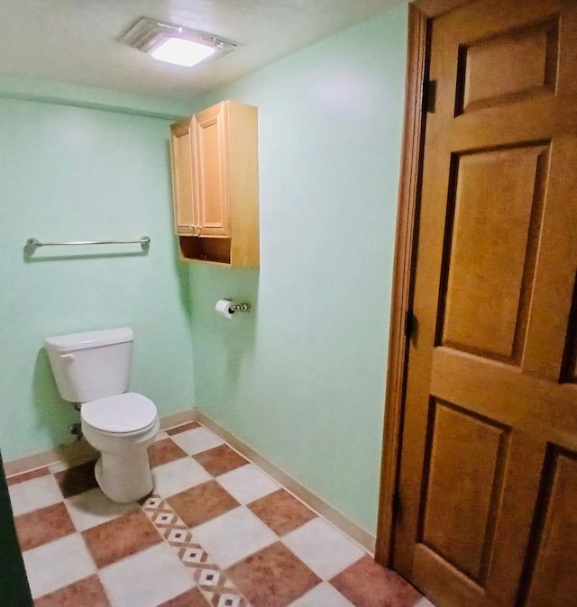 bathroom featuring toilet