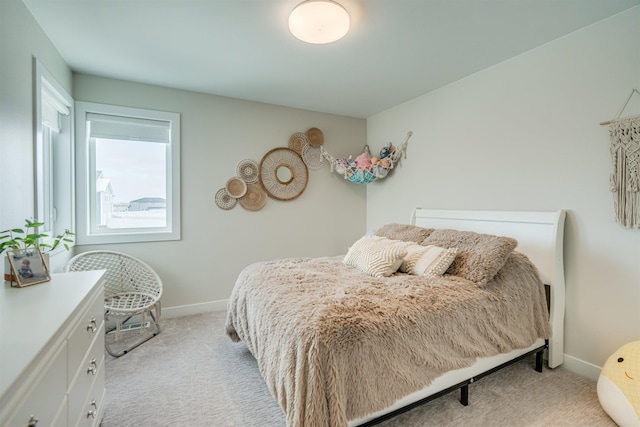 bedroom featuring light colored carpet