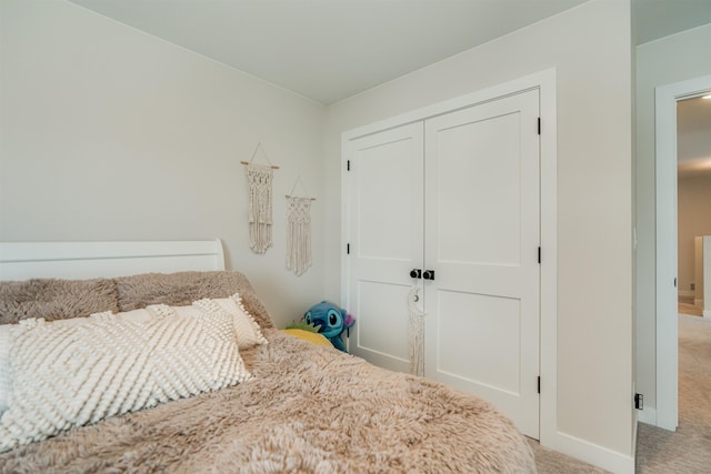 carpeted bedroom with a closet