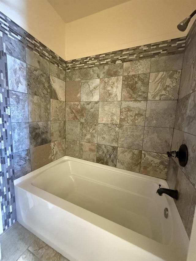 bathroom featuring tile patterned floors and shower / washtub combination