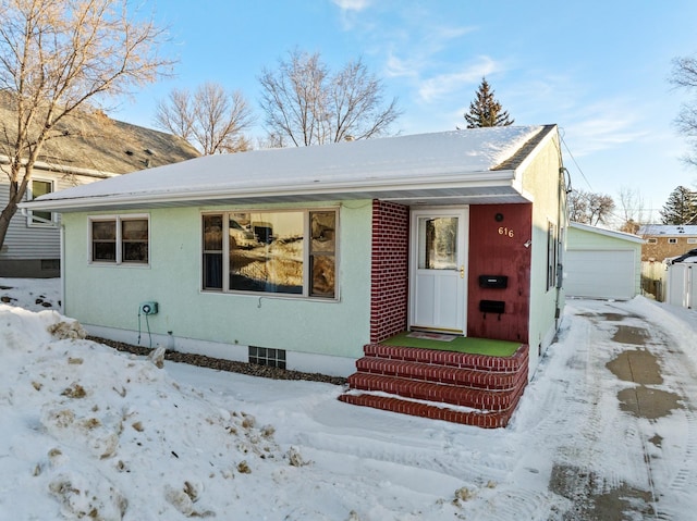 view of front of property with an outbuilding and a garage