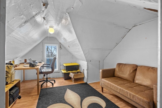 home office featuring lofted ceiling and wood-type flooring