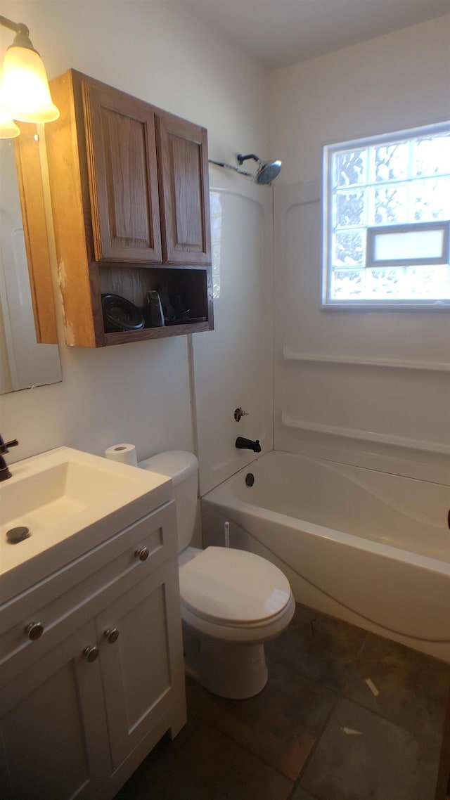 full bathroom with shower / tub combination, vanity, toilet, and tile patterned floors