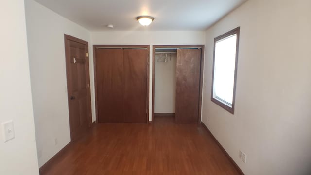 hallway featuring dark hardwood / wood-style floors