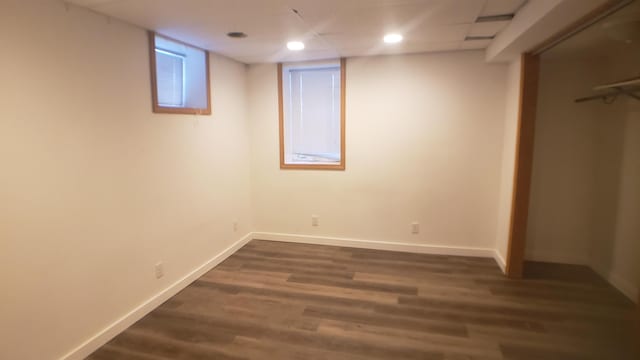 basement featuring dark hardwood / wood-style floors