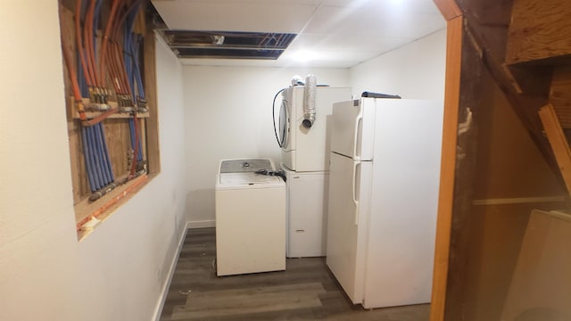 washroom featuring dark hardwood / wood-style floors and washer / clothes dryer