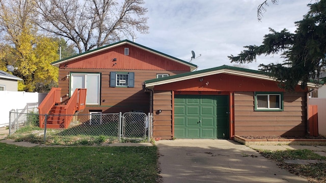 view of front of house with a garage, an outdoor structure, and a front yard