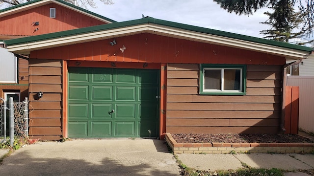 view of side of property featuring a garage and an outdoor structure