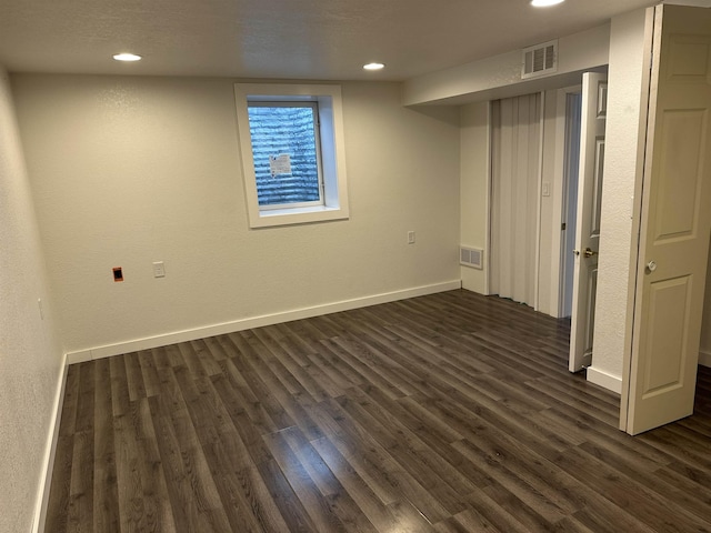 basement featuring dark wood-type flooring