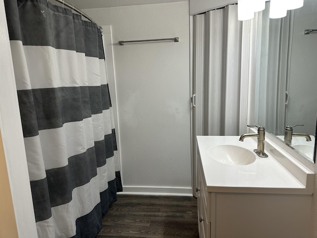 bathroom with vanity and hardwood / wood-style flooring