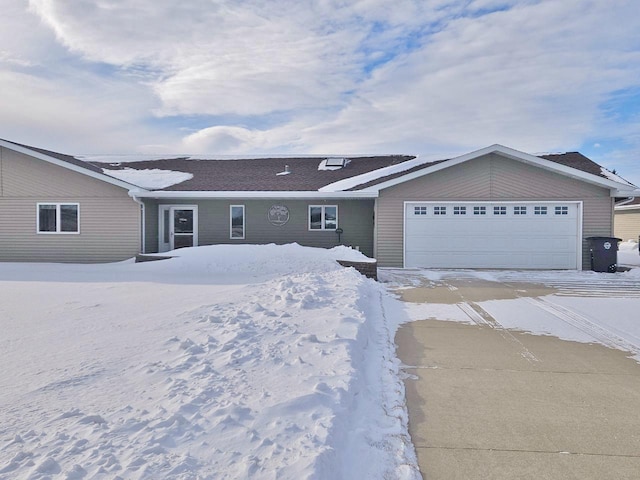 ranch-style house featuring a garage