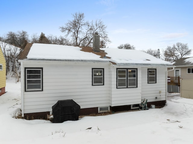 view of snow covered house