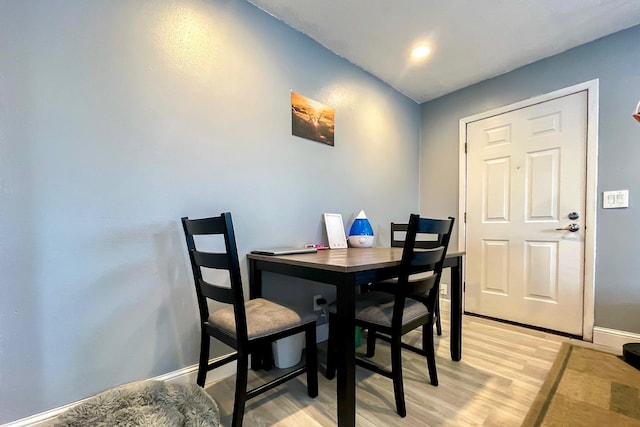 dining space with light hardwood / wood-style flooring