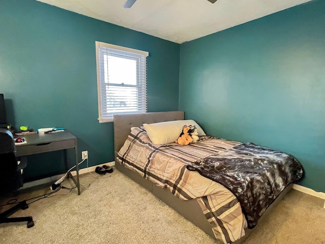 bedroom with ceiling fan and carpet flooring