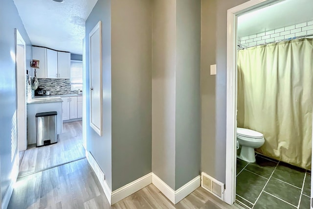 interior space featuring hardwood / wood-style floors and a textured ceiling