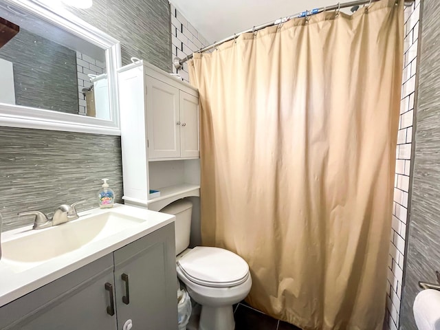 bathroom with toilet, tasteful backsplash, tile walls, vanity, and a shower with shower curtain