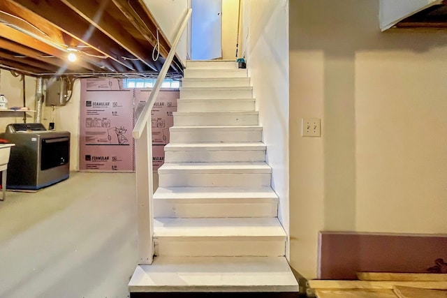 staircase featuring washer / clothes dryer