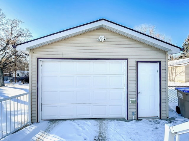 view of snow covered garage