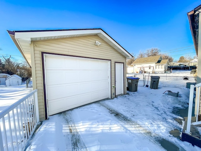 view of snow covered garage