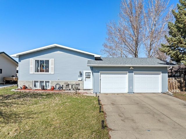 view of front of house with a garage and a front lawn