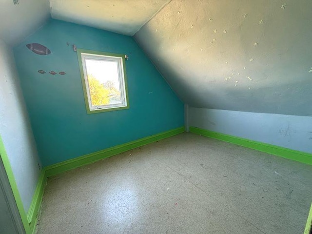 bonus room with vaulted ceiling