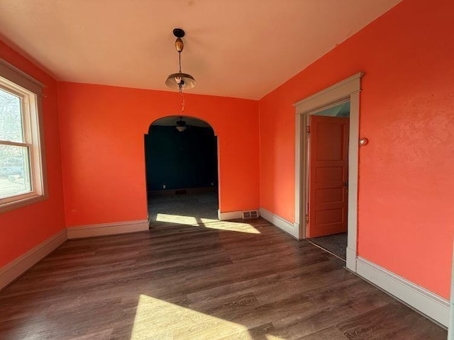 unfurnished dining area featuring dark hardwood / wood-style flooring