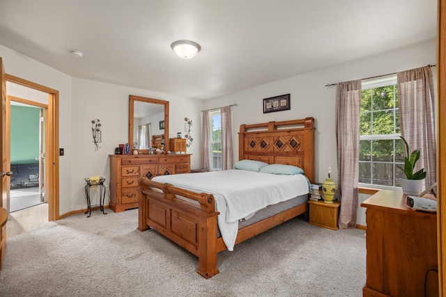 bedroom featuring light colored carpet