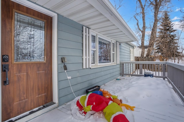 view of snow covered property entrance