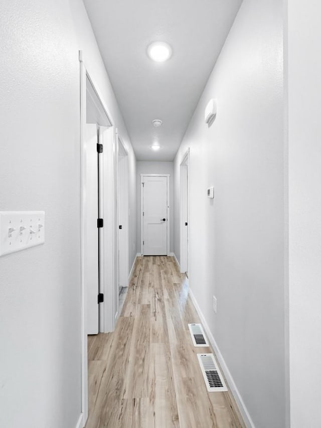 hallway featuring light wood-type flooring
