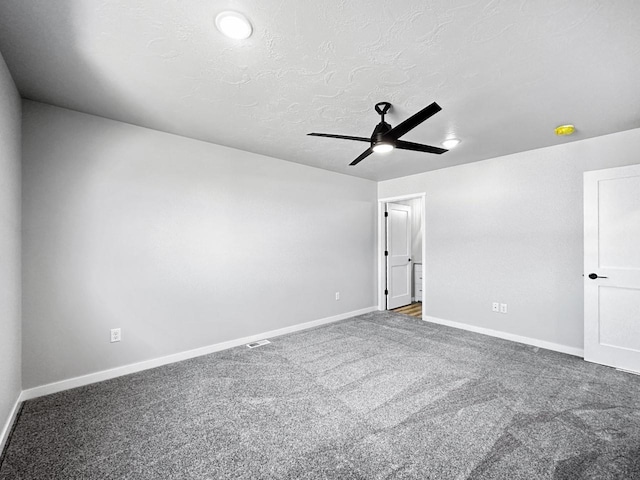 unfurnished room featuring a textured ceiling, ceiling fan, and carpet flooring