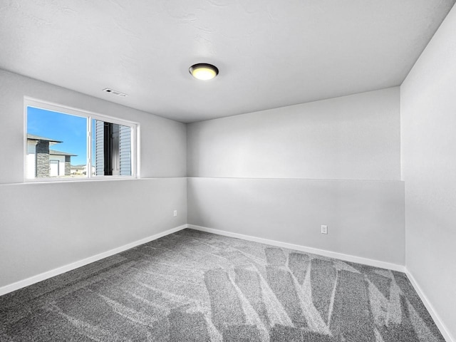 unfurnished room with carpet flooring