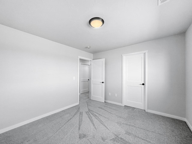 unfurnished bedroom featuring carpet