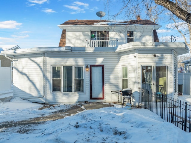 view of front of home with a balcony